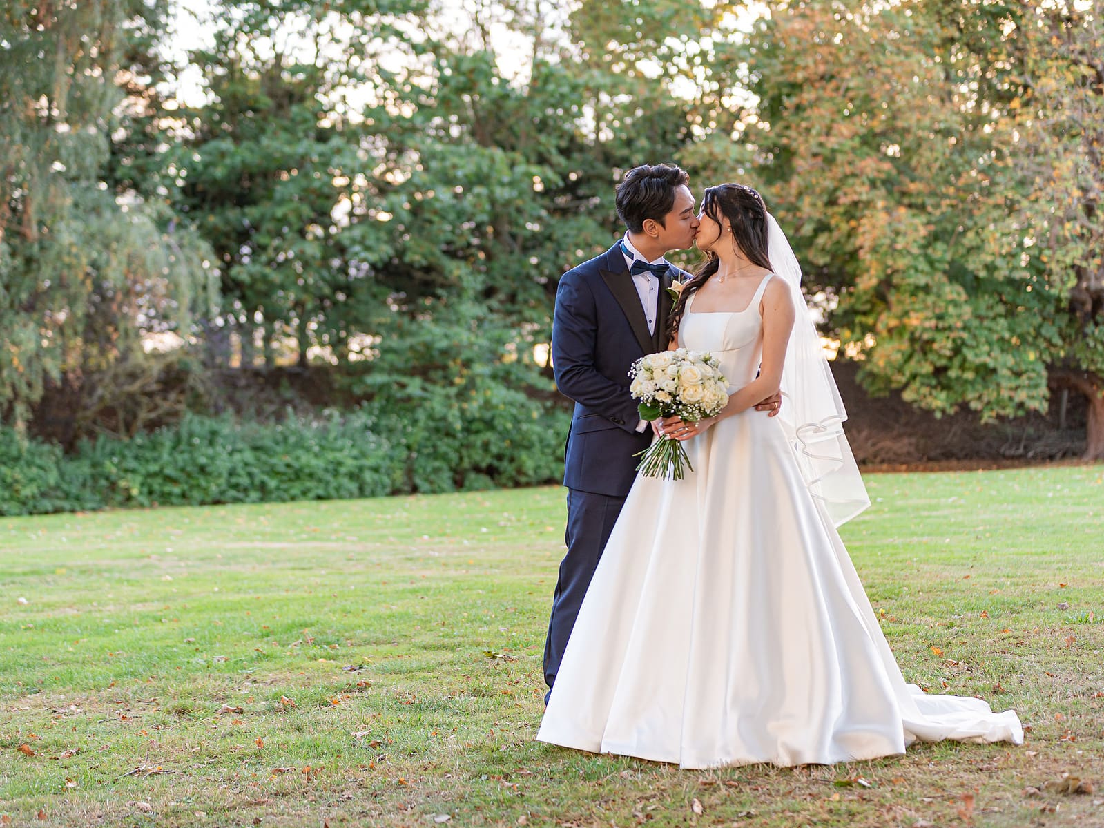 Catherine&Jack-Zoe-Mills-Photography-1-2 a man and woman kissing in a field