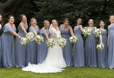 Ellie and Bridesmaids a man and woman kissing in a field