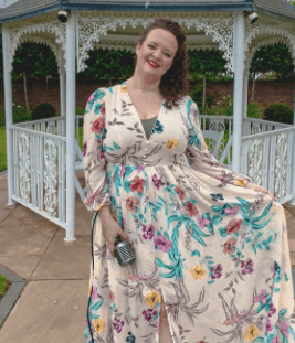 a man and woman kissing in a field