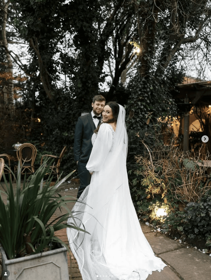 a man and woman kissing in a field