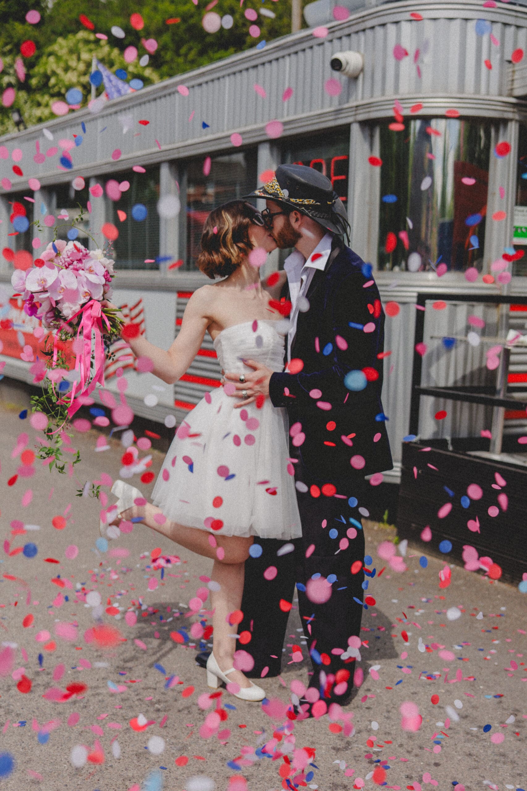 a man and woman kissing in a field