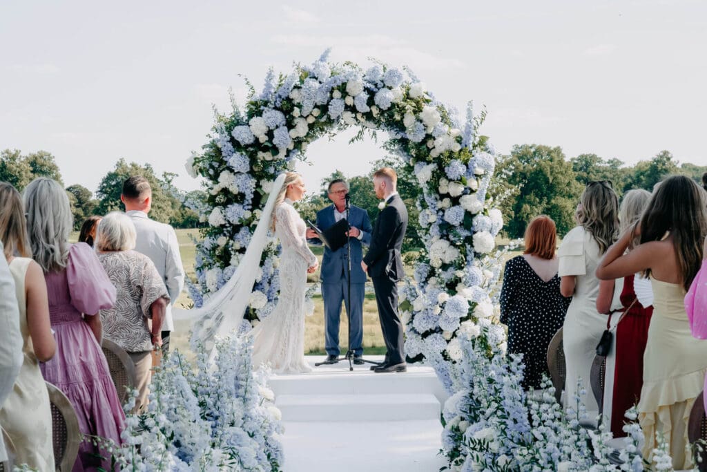 a man and woman kissing in a field