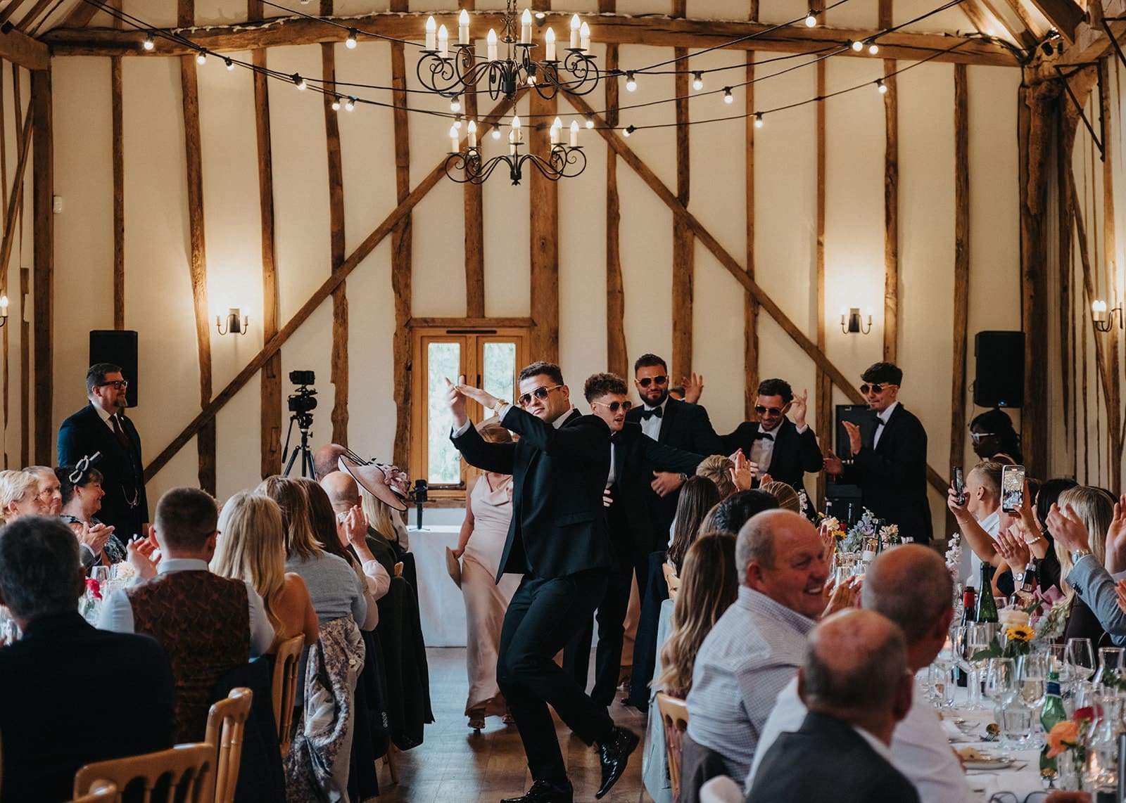 Wedding party making a grand entrance at an Essex wedding reception hosted by Liam Ball, Wedding Host in Essex.