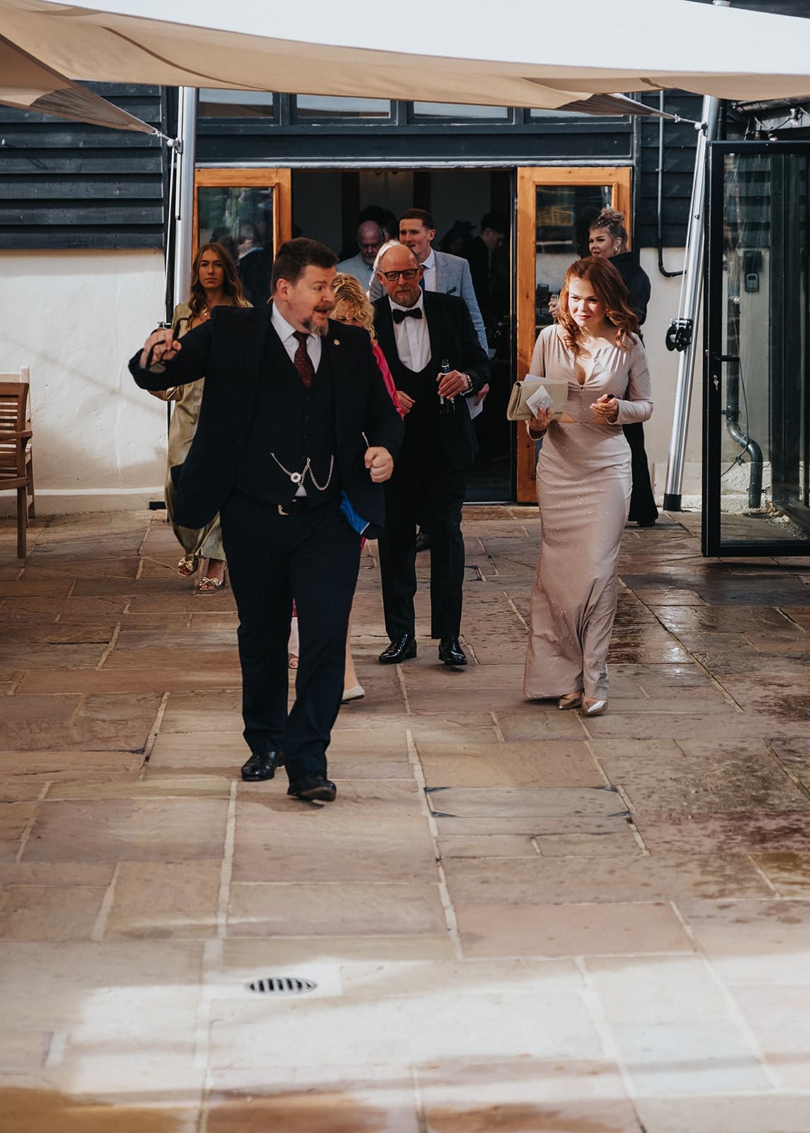 Wedding Host in Essex Liam Ball leading wedding guests outside and helping coordinate the day’s events.